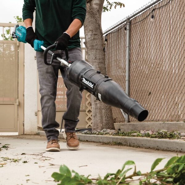 Makita UB401MP Action Shot (blowing leaves) UB401MP Blower Couple Shaft Attachment product image